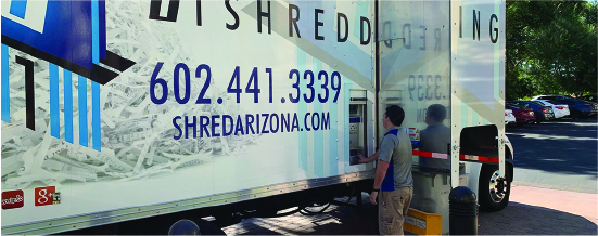 Shred truck drivers operating shredding truck